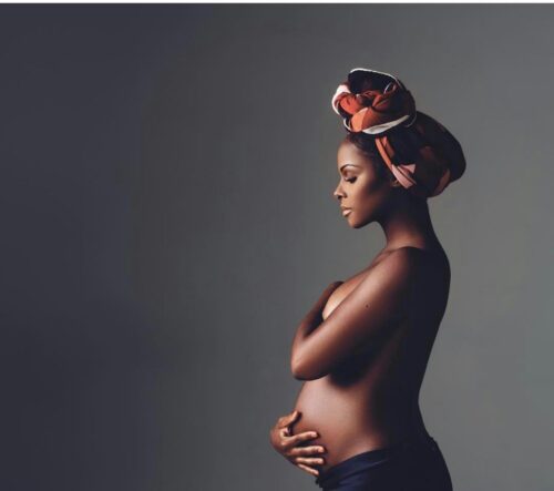 pregnant african american women topless and headwrap 