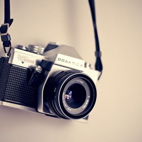 black camera with string 