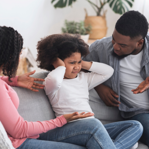 parents trying to talk to their strong willed child.